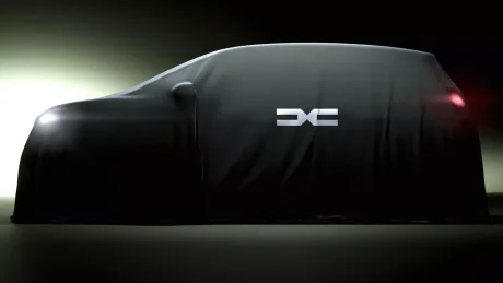 Un vehicul acoperit, simbolizând dezvoltarea unui nou model electric.