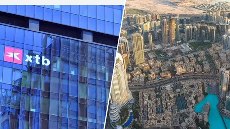 Clădire modernă cu logo XTB și peisaj urban dintr-o metropolă