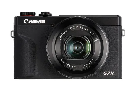 Aparat foto compact Canon PowerShot cu design modern și obiectiv versatil.