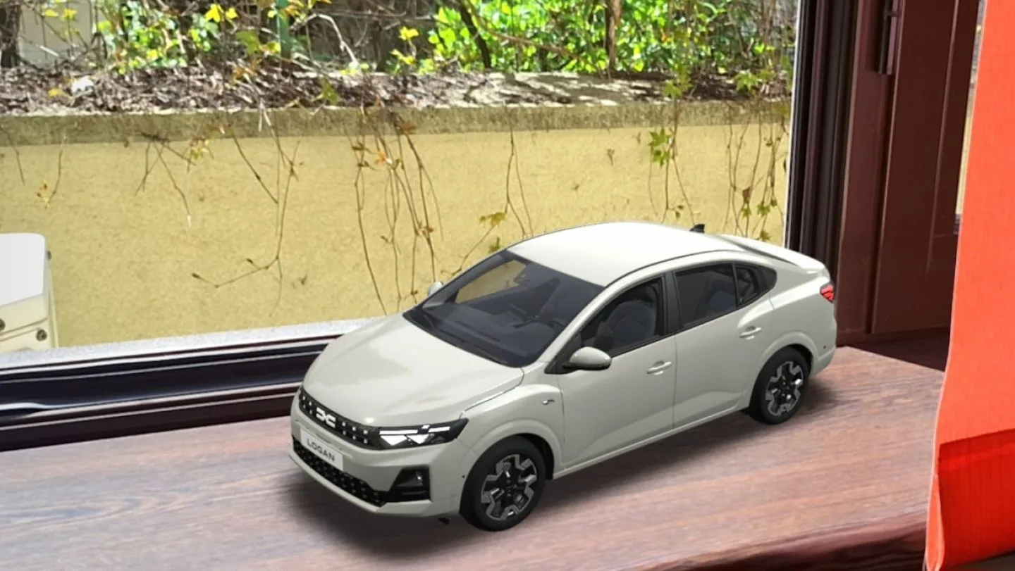 Modelul Dacia Logan în realitate augmentată pe o masă, cu detalii vizibile.