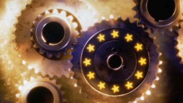 Roți dințate cu stele, simbolizând politica monetară europeană.