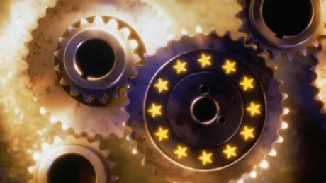 Roți dințate cu stele, simbolizând politica monetară europeană.