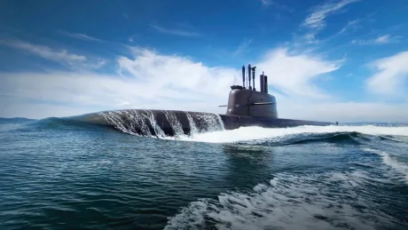 Submarin modern navigând pe apă, cu cer senin și valuri.
