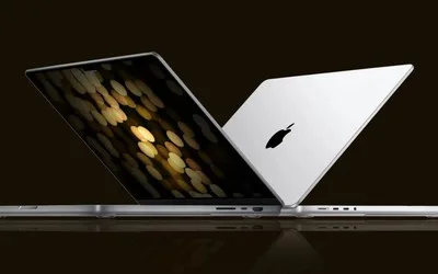 Un MacBook cu un design modern și elegant, evidențiind ecranul și logo-ul Apple.
