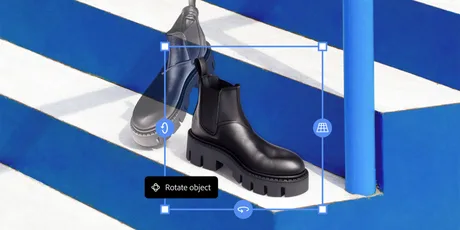 Un bot de piele neagră pe o scară albă și albastră, evidențiind rotația obiectului.