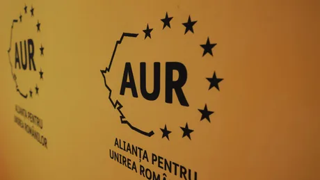 Logo-ul AUR pe un fundal galben, simbolizând propunerile economice ale partidului.