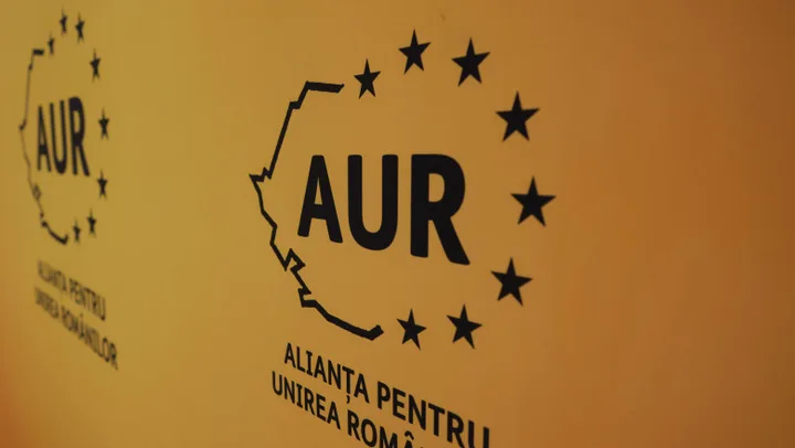 Logo-ul AUR pe un fundal galben, simbolizând propunerile economice ale partidului.
