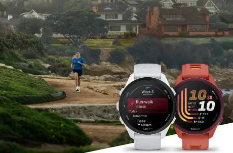 Ceasuri de alergare Garmin Forerunner 70 și 170 pe un fundal natural.