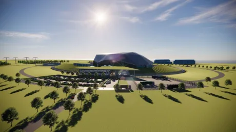 Viziune artistică a unui reactor nuclear modular pe un teren verde.