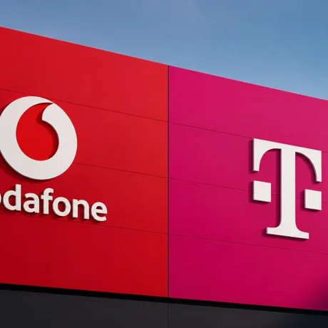 Logo-urile Vodafone și Telekom pe un fundal colorat, simbolizând fuziunea dintre cele două companii.