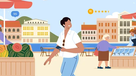 Persoane care se bucură de o zi însorită pe malul mării, explorând magazine locale.