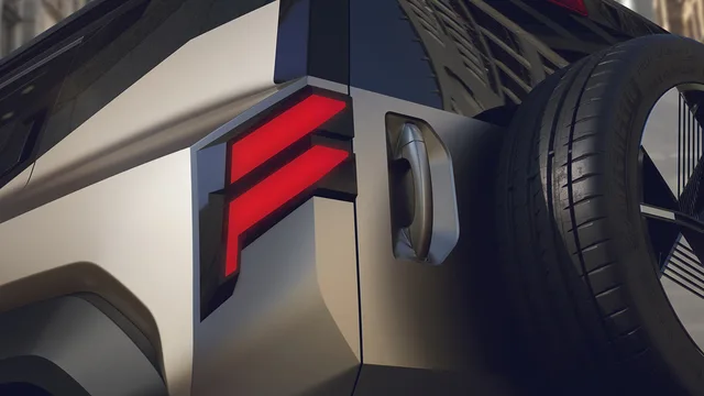 Detaliu al unui vehicul modern, evidențiind lampa spate și roata.