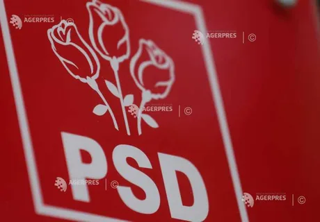 Sigla PSD cu trandafiri pe fundal roșu, simbol al partidului.