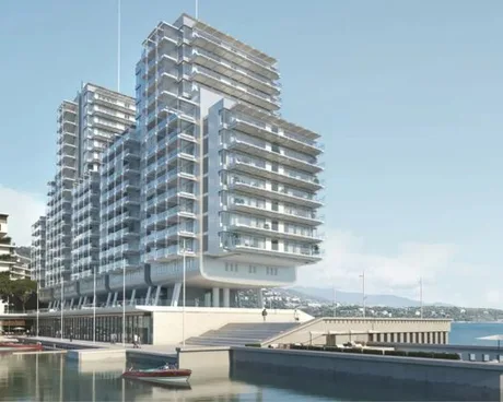 Complex rezidențial modern pe malul mării, cu arhitectură contemporană.