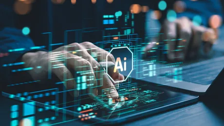 Mâini interacționând cu un dispozitiv digital, simbol AI vizibil.