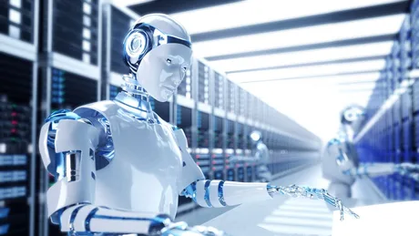 Robot cu aspect futurist lucrând într-un mediu tehnologic avansat.