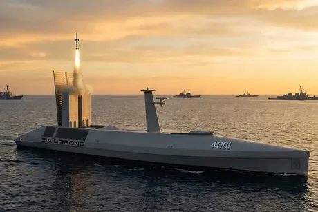 Dronă maritimă autonomă lansând rachete Tomahawk pe fundalul mării la apus.