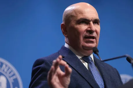 Premierul Ilie Bolojan susține reformele în fața susținătorilor săi.