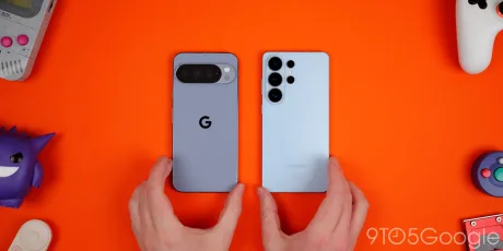 Două telefoane inteligente pe un fundal portocaliu vibrant.